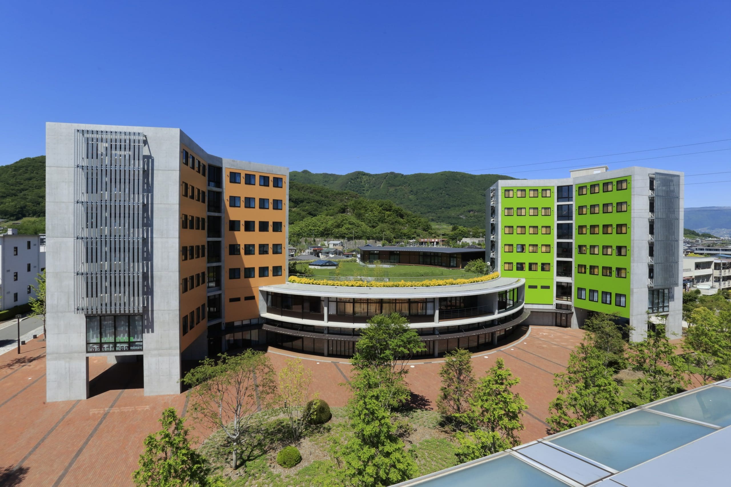 Wide shot of iCLA campus with hills in background