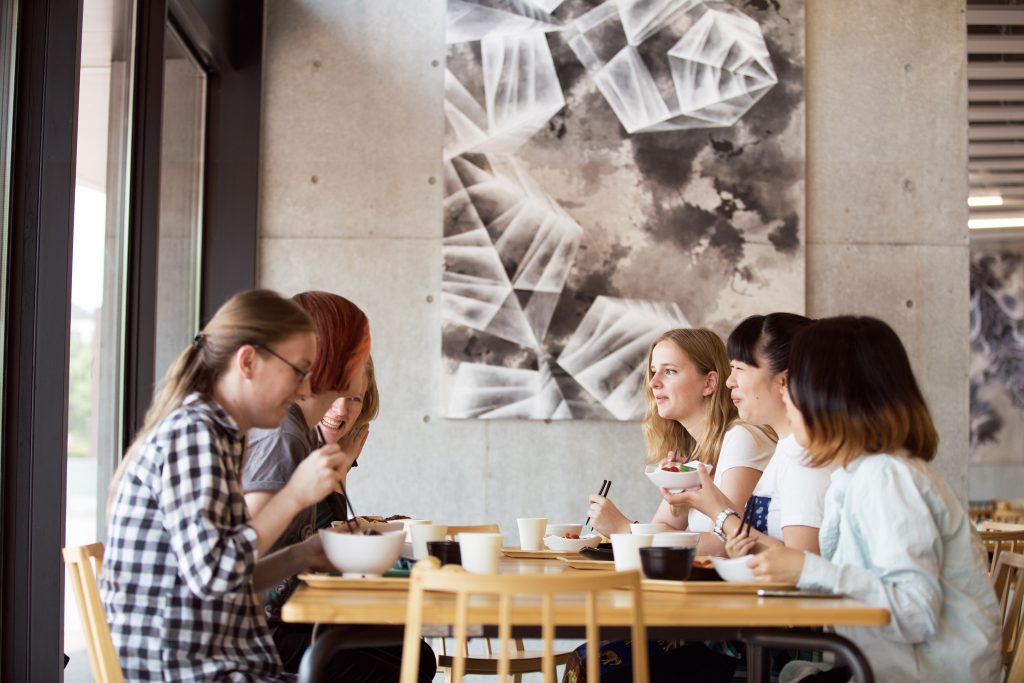 International students eating together in student cafeteria