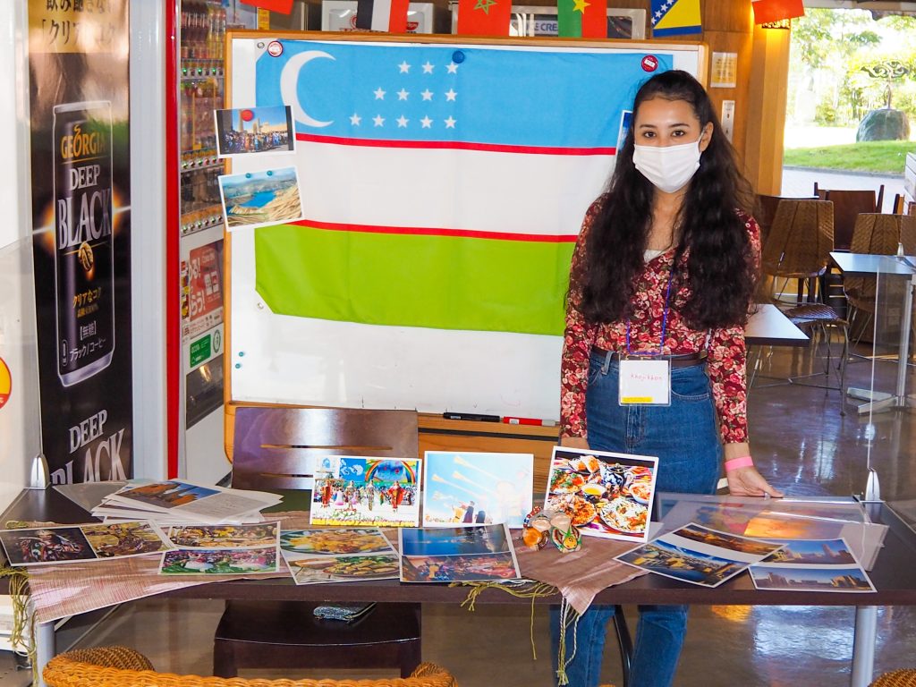 International student from Uzbekistan showcasing culture booth at campus event