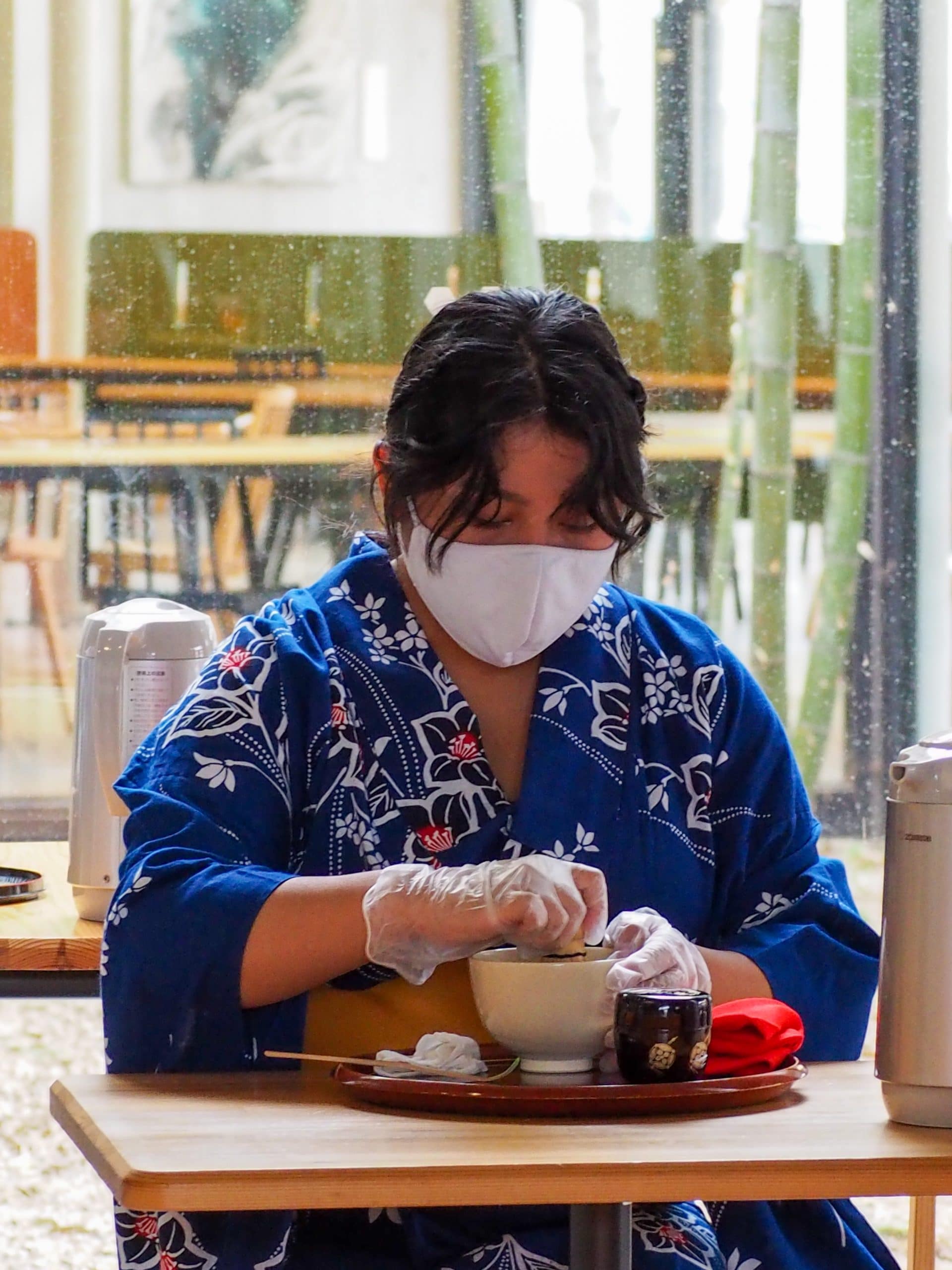 An international student performs tea ceremony in front of an audience