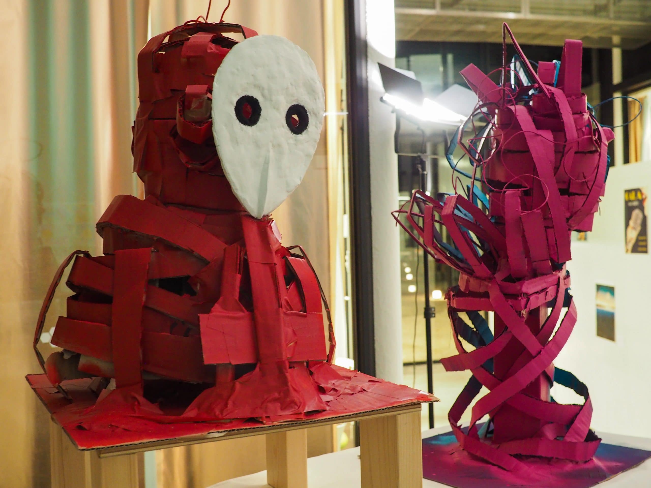 Student artwork made using cardboard on display at art exhibition
