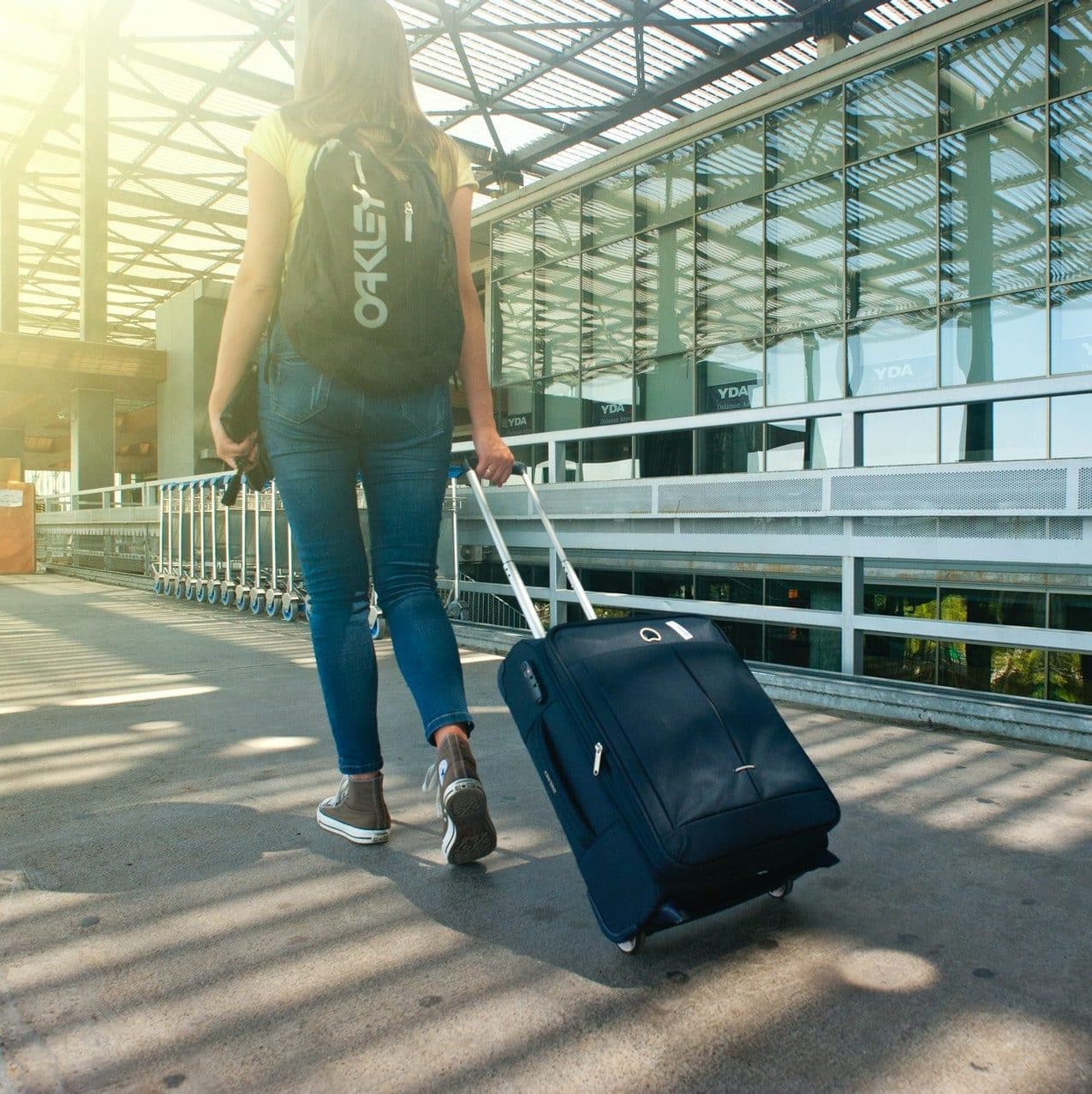 Girl traveling with suitcase. 