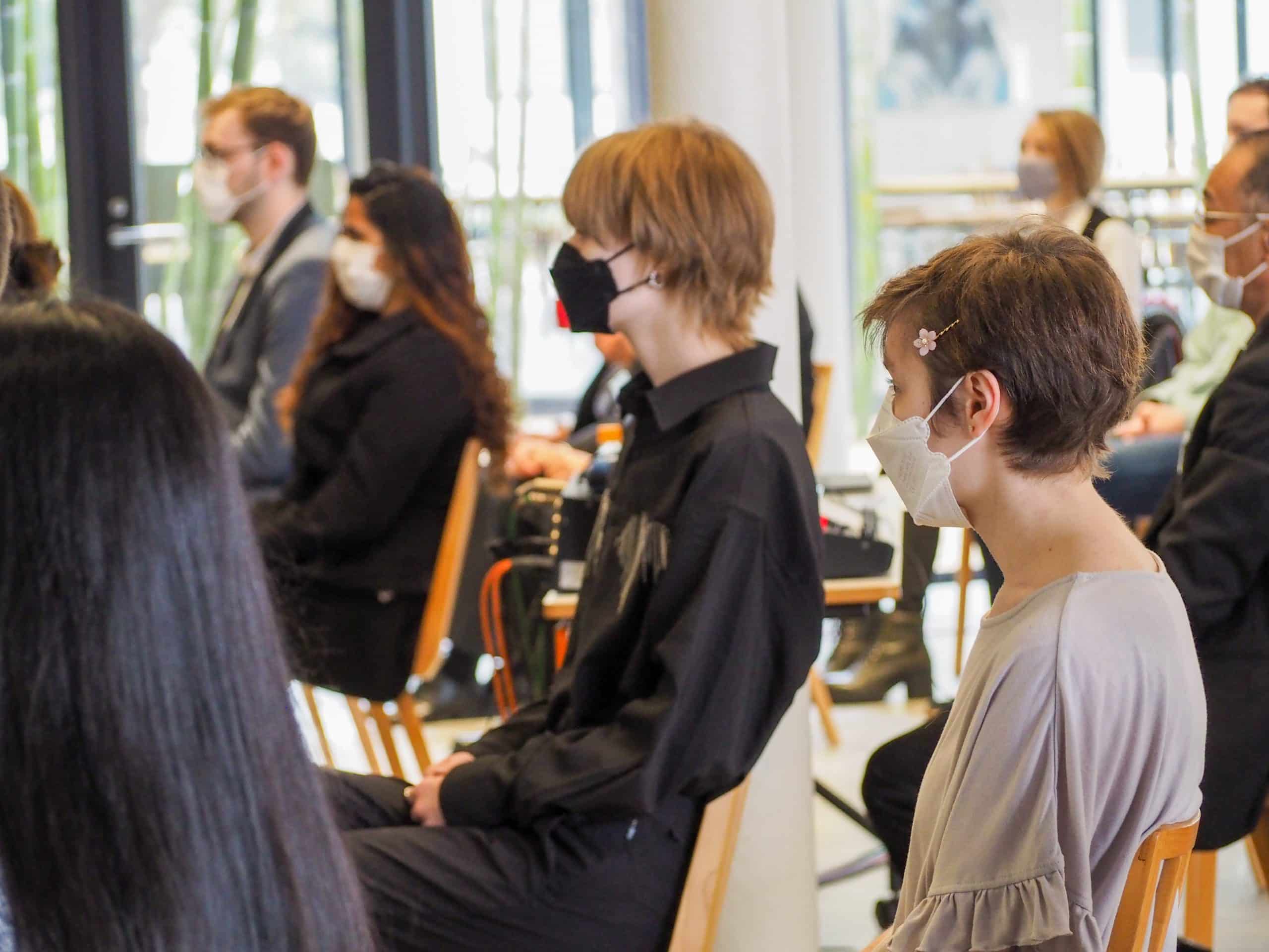 iCLA students listen to the Dean's speech