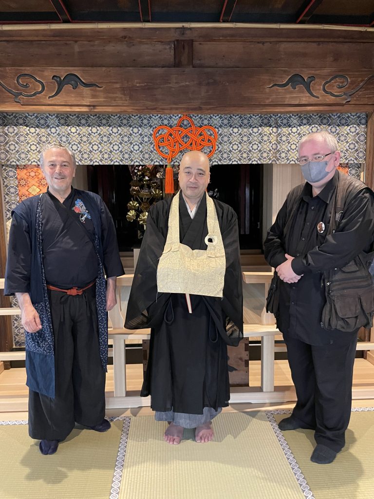iCLA professors stand together with Erinji's head priest