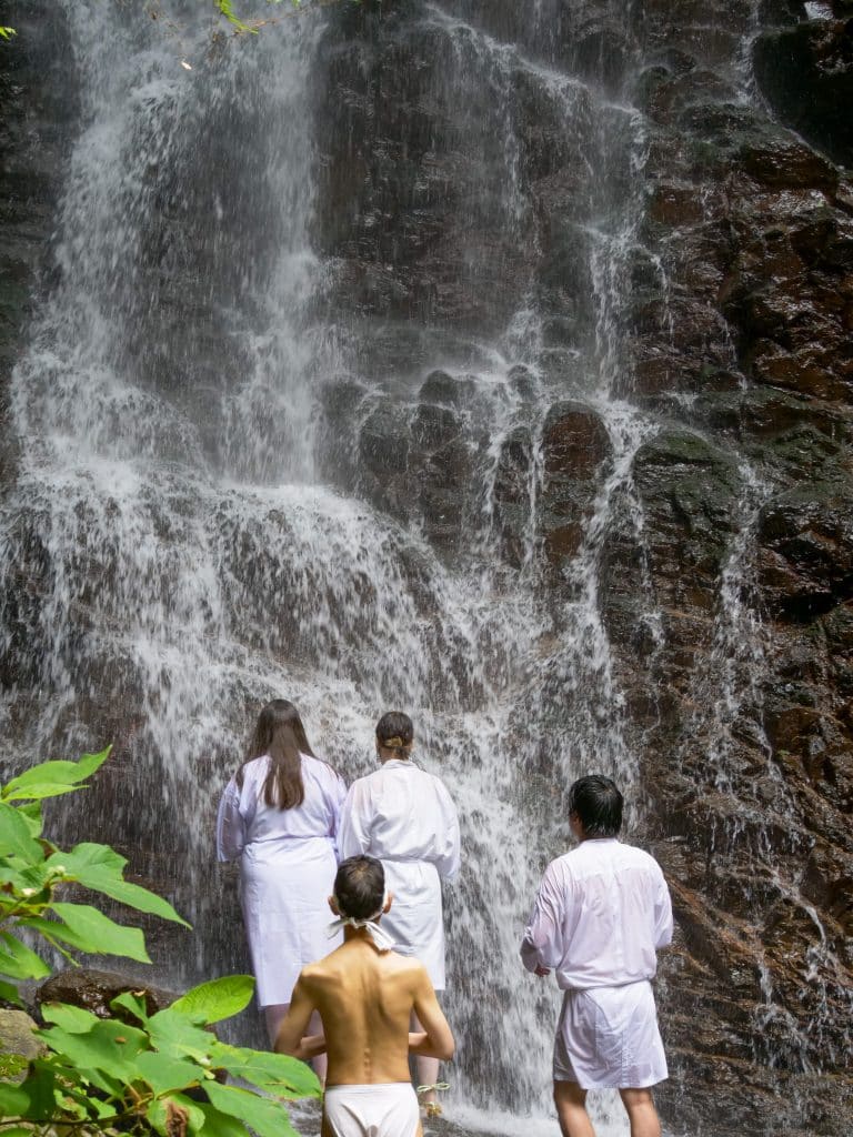 iCLA students doing Shugendo waterfall training at Kawaguchi Asama Shrine's Haha no Shirataki