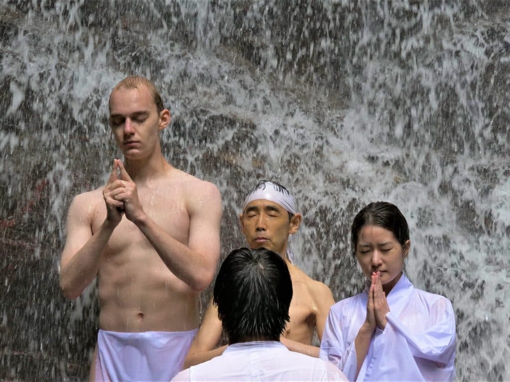 iCLA students doing Shugendo waterfall training at Kawaguchi Asama Shrine's Haha no Shirataki