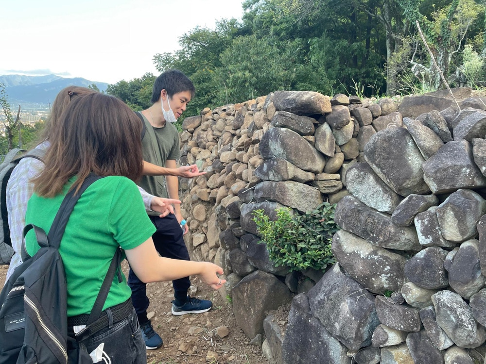 iCLA students looking at ancient burial mound