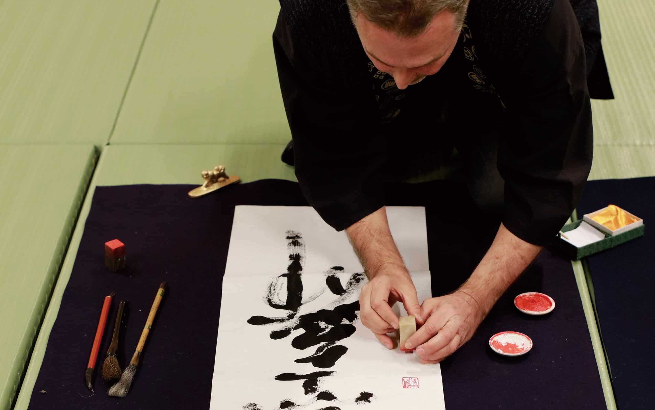 Professor William Reed doing Shodo