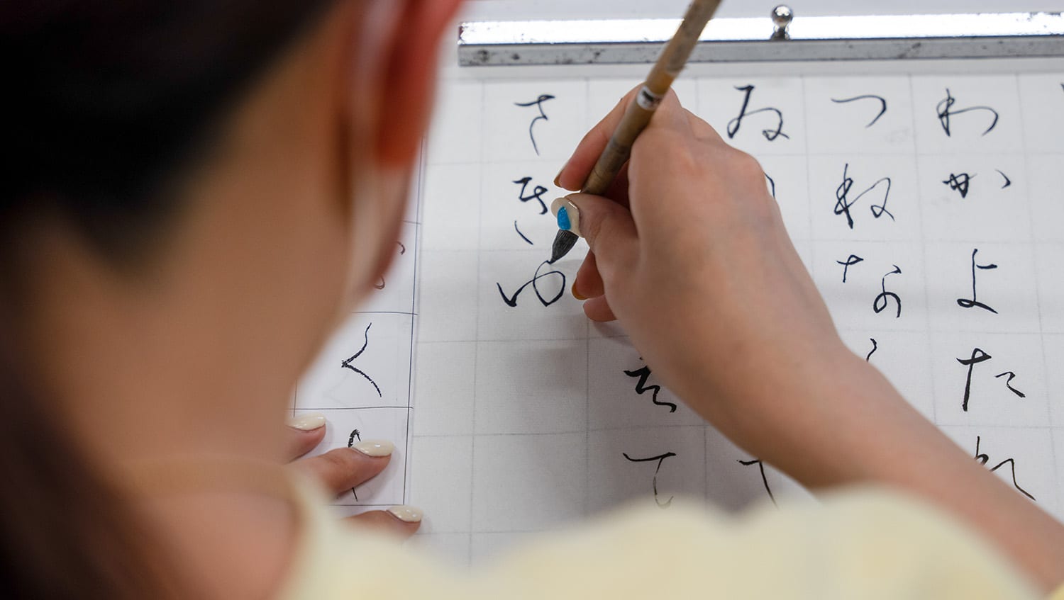 iCLA Student writing Japanese Calligraphy
