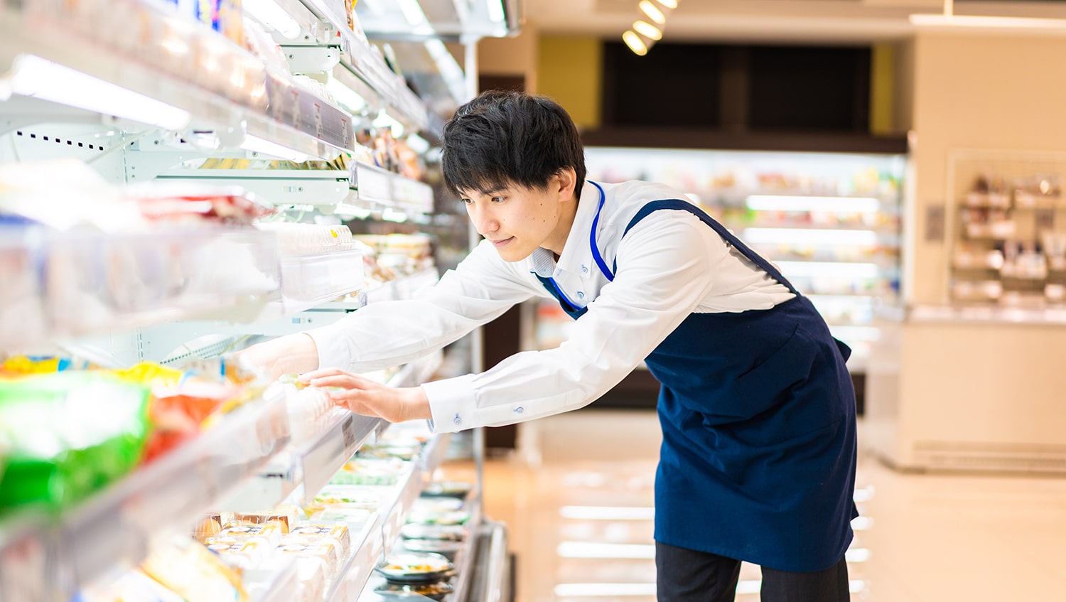 Man stacking shelves in a supermarket