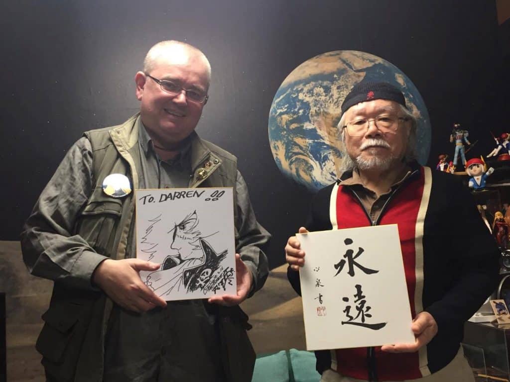 iCLA professor Dr. Darren Ashmore with late manga artist, Leiji Matsumoto