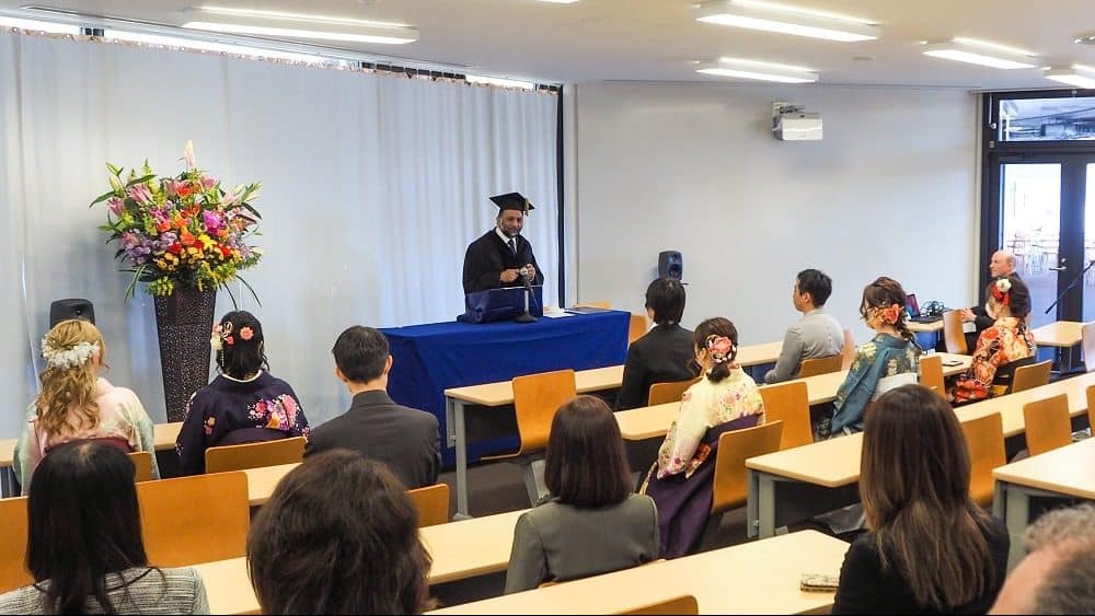 Dean Dr. Sanjay Jhingan giving a speech at iCLA's Spring 2023 Graduation Ceremony.