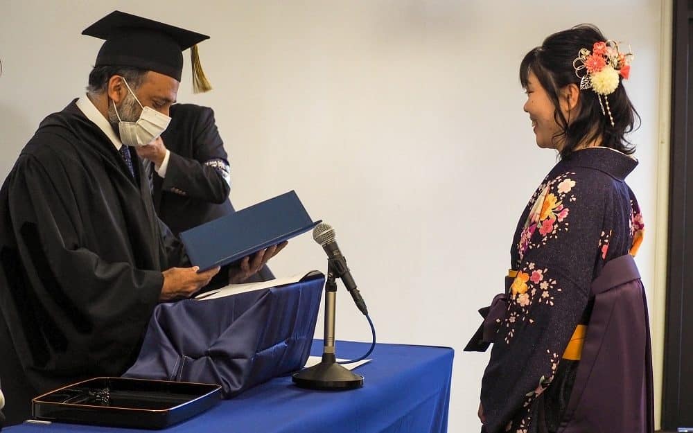 iCLA's Student of the Year Award Recipient receives her certificate at the Graduation Ceremony.