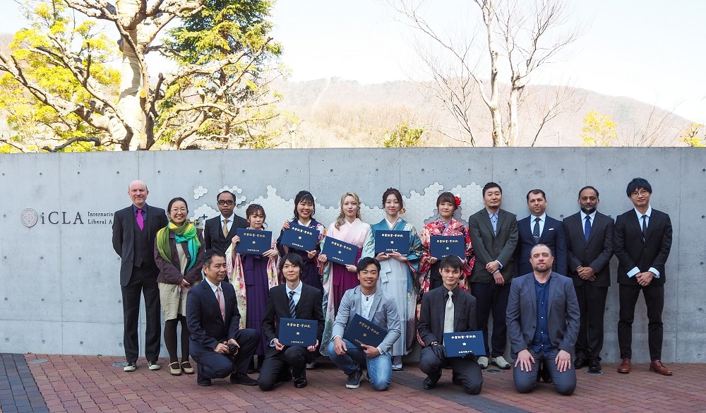 iCLA graduates gathered in front of the building in a group photo.