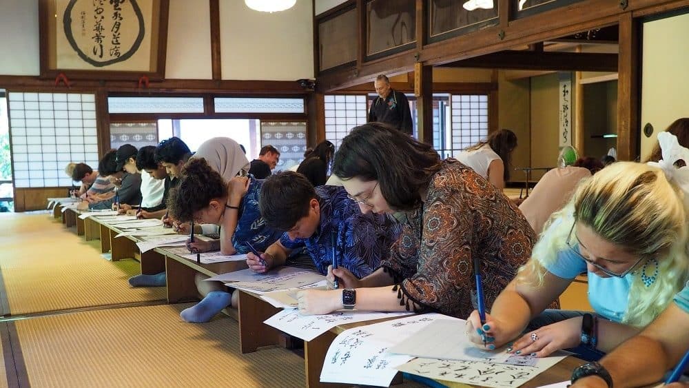 iCLA international students participate in the iEXPerience Program and practice Shakyo at Erinji Temple.