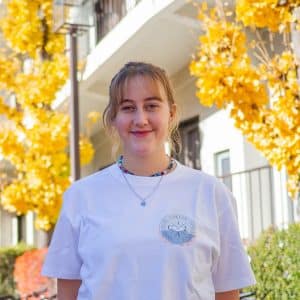 iCLA exchange student wears t-shirt with her logo design.