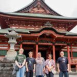 Professor William Reed and iCLA students stand in front of Kai Zenkoji Temple together for a group photo.