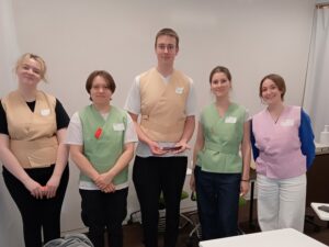 iCLA students are posing for a group photo after their Japanese tea ceremony or Sado class is over. They are wearing traditional practice attire for Sado.